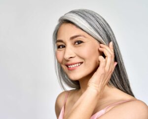 woman smiling at camera.