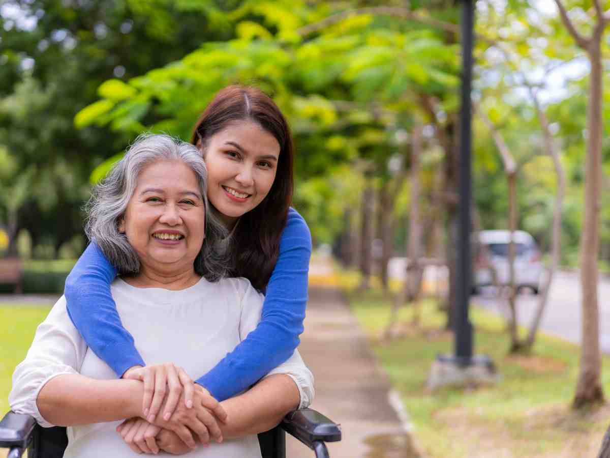 woman with arms around her mother.