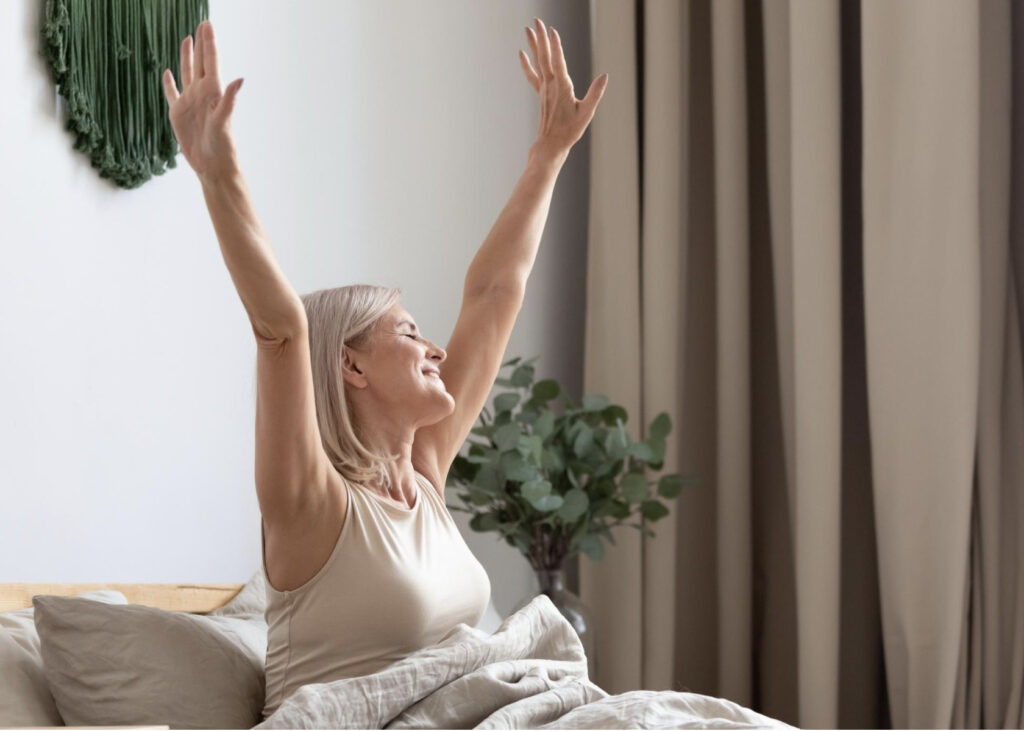 woman waking up refreshed.