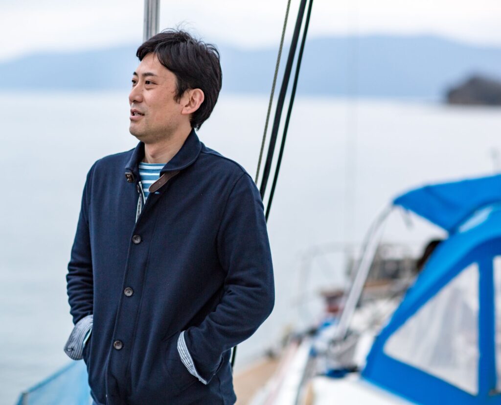man on boat looking out at water.