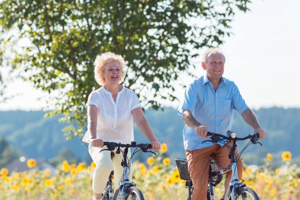 woman and man riding bikes together.
