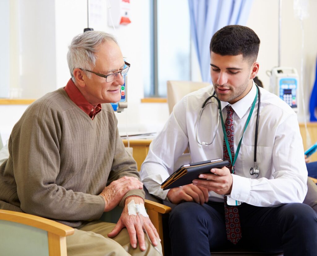 man talking to doctor.