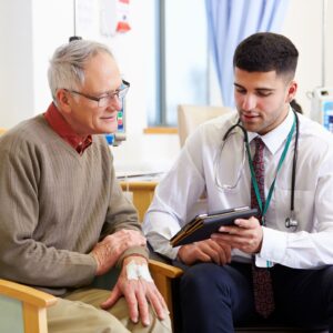 man talking to doctor.