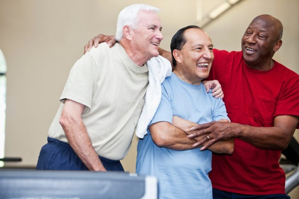 group of men with arms around eachother.