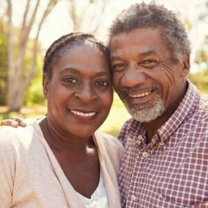 man and woman smiling at camera.