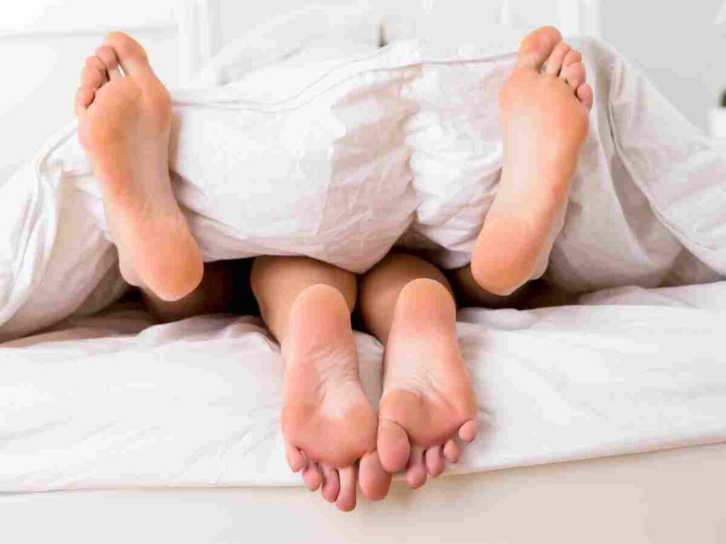 man and woman in bed.