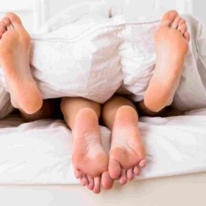 man and woman in bed.