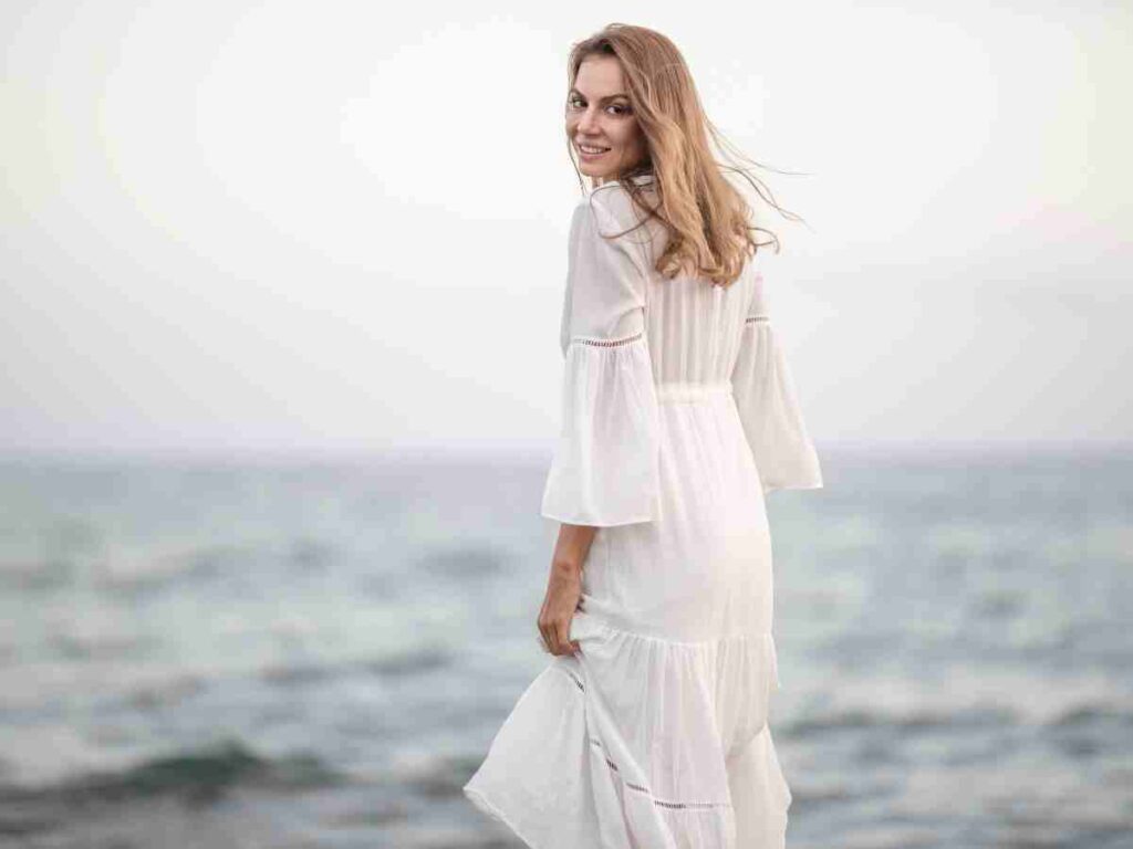 woman walking turned around looking at camera.