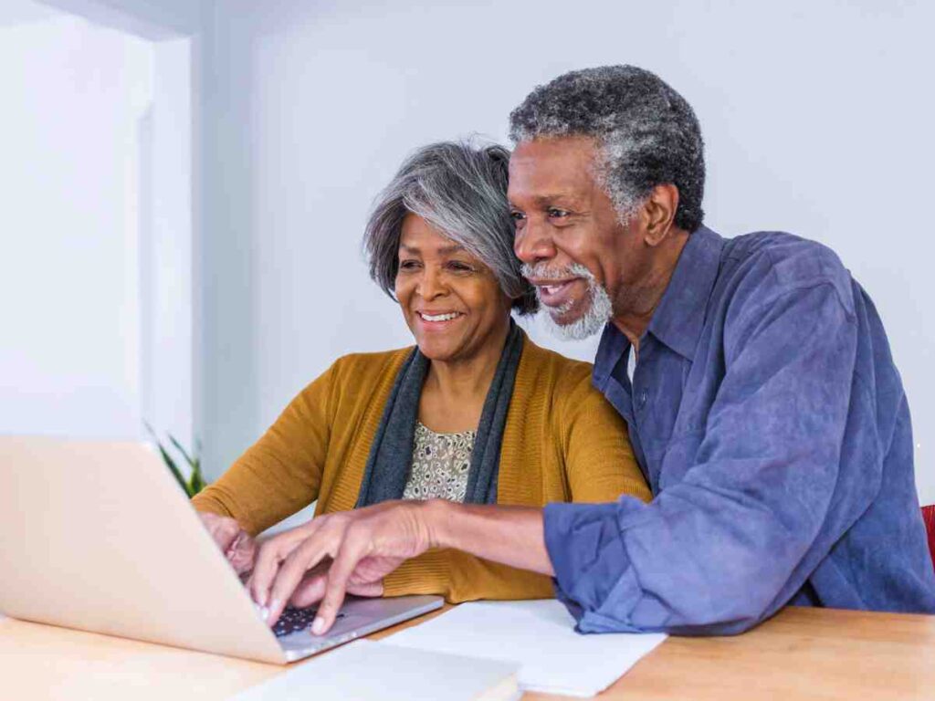 older couple looking at computer.