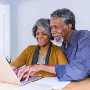 older couple looking at computer.