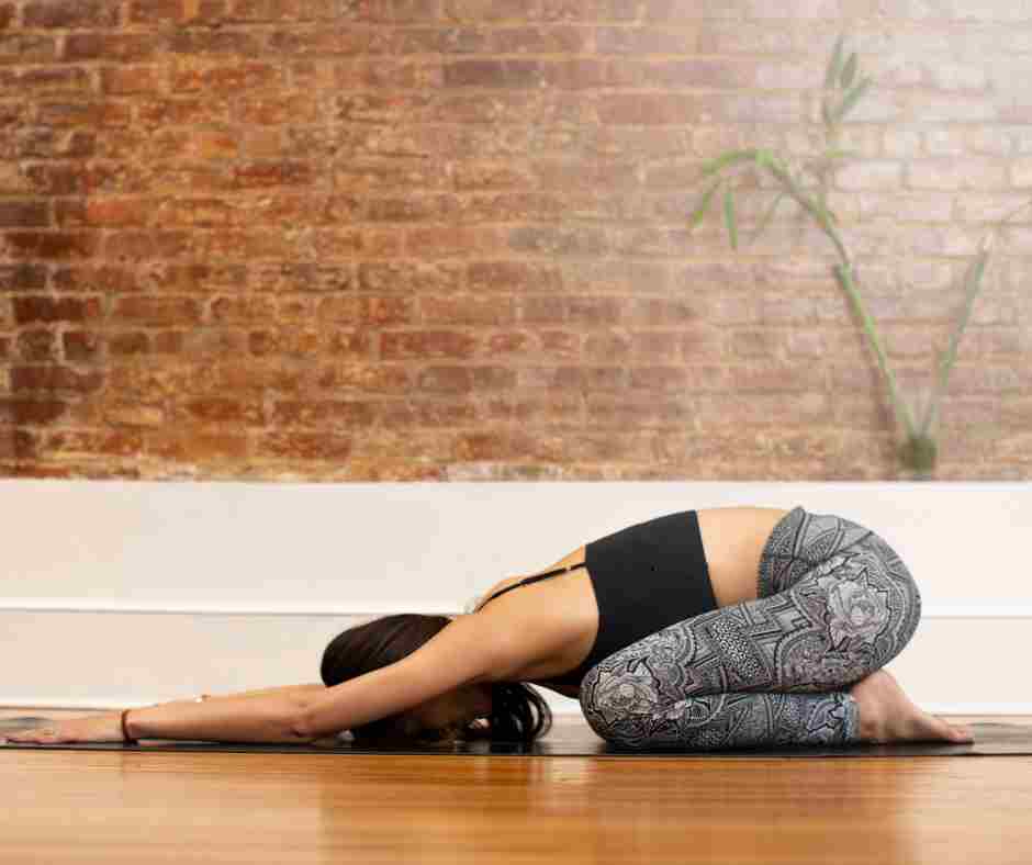 woman doing childs pose.